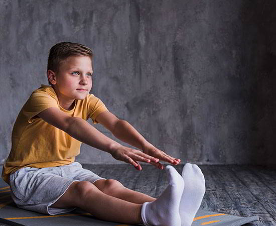 close-up-boy-wearing-white-socks-stretching-his-hand